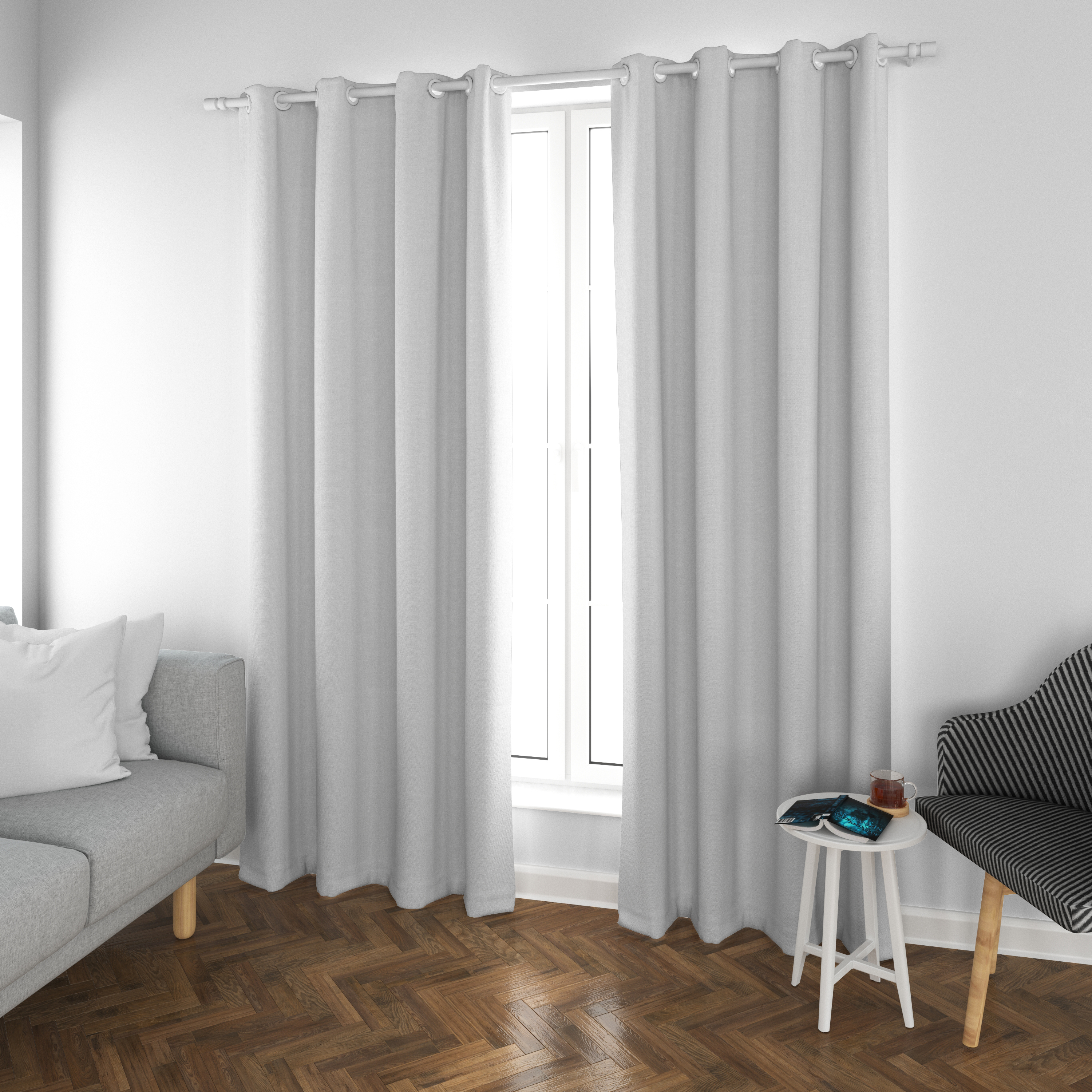 Woman pulling down fabric roller blinds in a modern Dubai living room